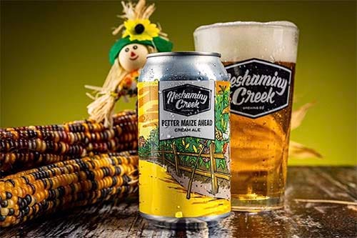 Neshaminy Better Maize Cream Ale can with glass and corn..