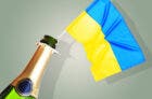 An opened bottle with a Ukrainian flag hanging out of it