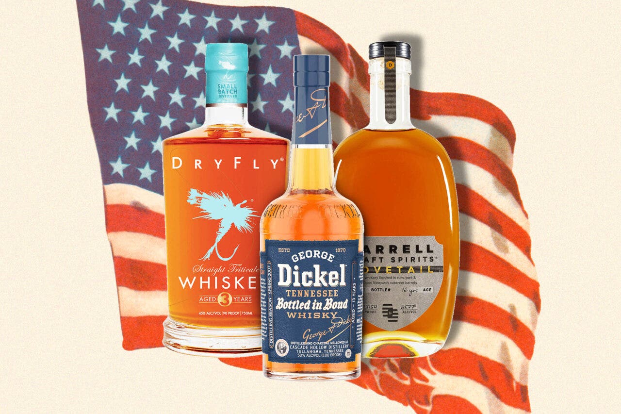 3 bottles of whiskey on a designed background with an American flag