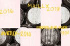 a digital collage of champagne barrels with production dates