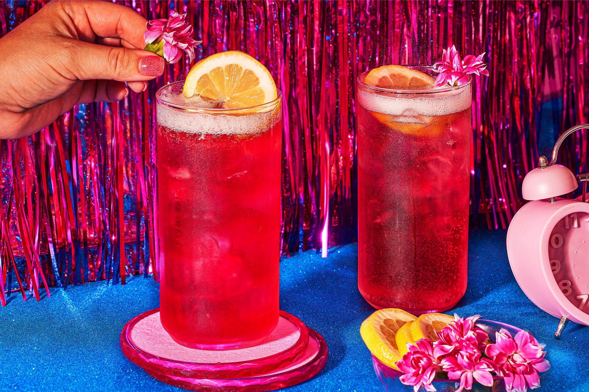 Adding a garnish to a barbie cocktail
